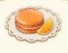 Símbolo Macaron de Laranja slot Baker’s Treat por Play'n GO