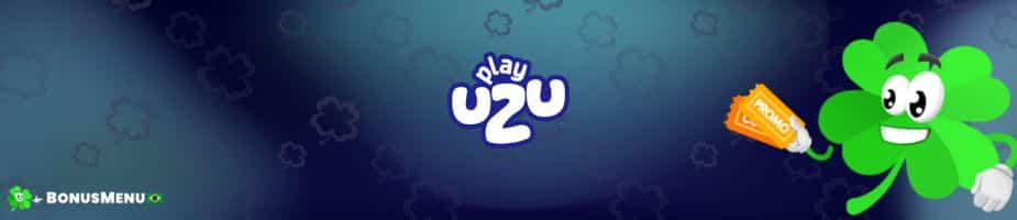 Código Bônus PlayUZU Brasil em um banner com um mascote de trevo de 4 folhas segurando a placa da promoção.