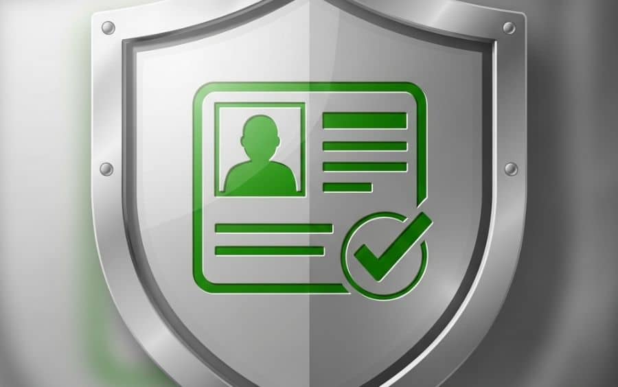 Ícone de um escudo de segurança metálico, contendo um símbolo de documento de identidade e um check de verificação, ilustrando a proteção da Verificação de Identidade (KYC) na F12.bet.