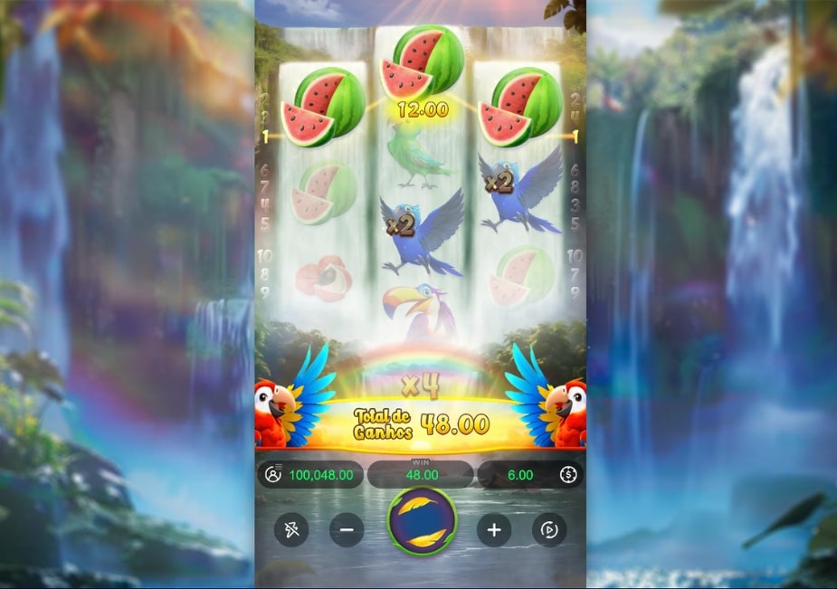 Tela do slot Wings of Iguazu com tucano, frutas tropicais e cenário de cachoeira ao fundo.