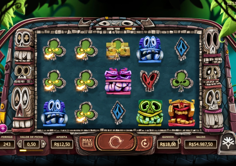 Tela do slot Big Blox da Yggdrasil com símbolos tribais coloridos, blocos especiais e cenário de floresta tropical.